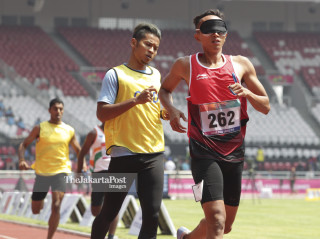-Atlet Indonesia Dalimunte Abdul Halim turun pada kualifikasi nomor 200m T11 putra Asian Para Games 2018