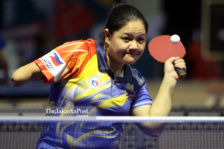 Atlet tenis meja Philipina Cadag Minnie ketika menghadapi petenis meja China Taipei Tian Shiau Wen babak penyisihan